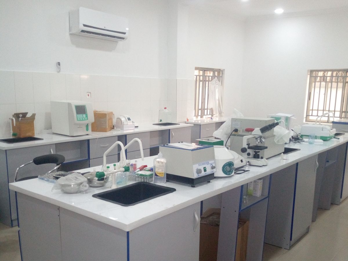 The in-house laboratory at JJANED Specialist Hospitals, with analysers, centrifuge and microscope on the benches